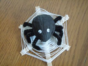 Halloween craft; walnut shell spider